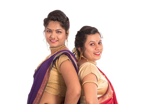 Traditional Beautiful Indian young girls in saree posing on white background