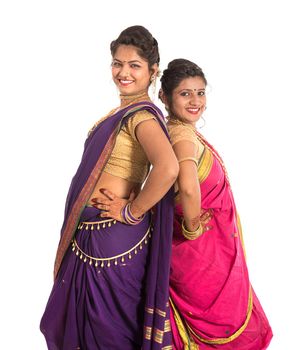 Traditional Beautiful Indian young girls in saree posing on white background