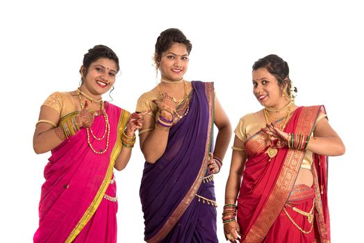 Traditional Beautiful Indian young girls in saree posing on white background