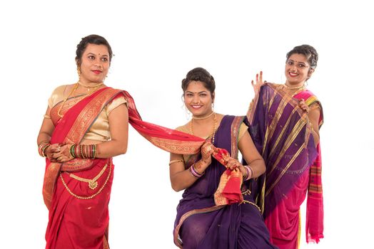 Traditional Beautiful Indian young girls in saree posing on white background