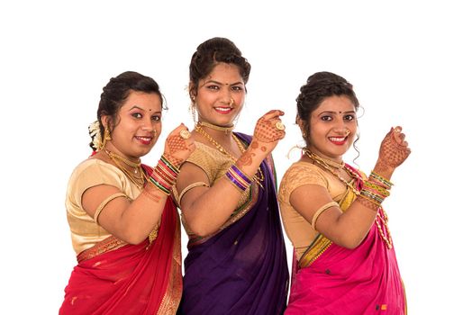 Traditional Beautiful Indian young girls in saree posing on white background