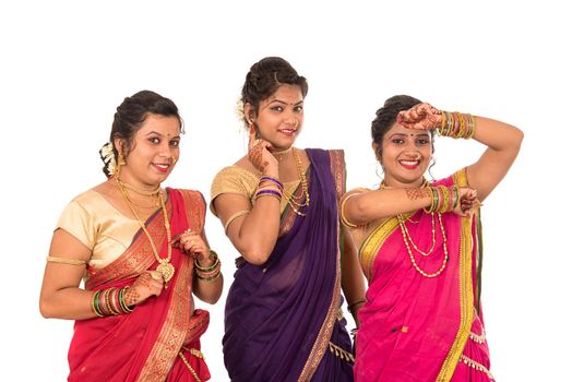 Traditional Beautiful Indian young girls in saree posing on white background