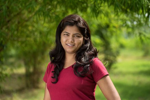 Portrait of beautiful Young girl outdoors in park.