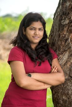 Portrait of beautiful Young girl outdoors in park.