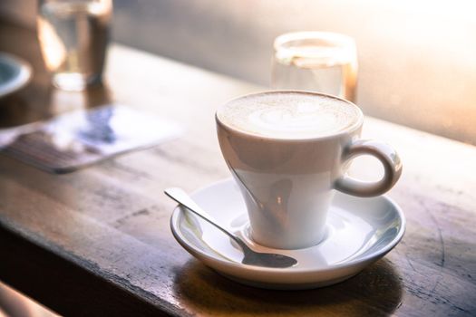 Cup of fresh brewed cappuccino in an Italian café