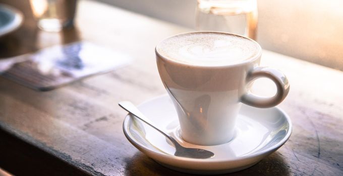 Cup of fresh brewed cappuccino in an Italian café