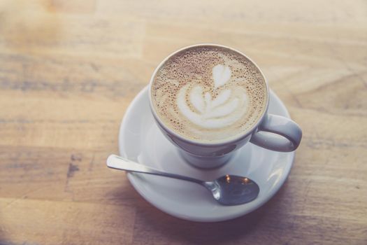 Cup of fresh brewed cappuccino in an Italian café