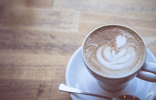 Cup of fresh brewed cappuccino in an Italian café