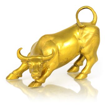 An isolated over white image of a completely metal bull statue with a minor surface reflection.