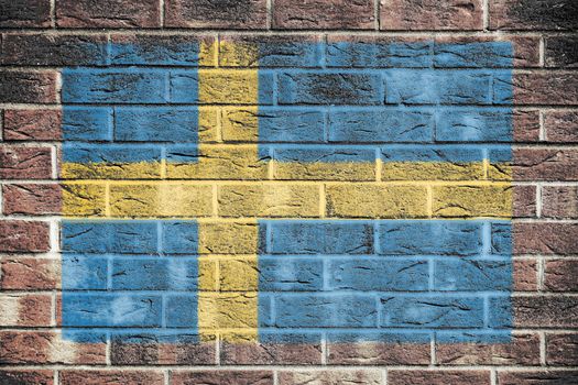 A Sweden flag on a brick wall background