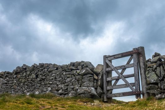 A Wooden Gate In An Old Dry Stone Wall In Scotland, With Copy Space