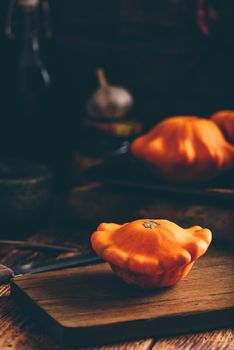 Raw pattypan squash on cutting board