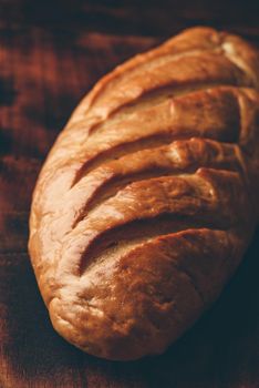 A loaf of bread on a wooden table