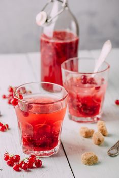 Infused water with fresh red currant and cane sugar