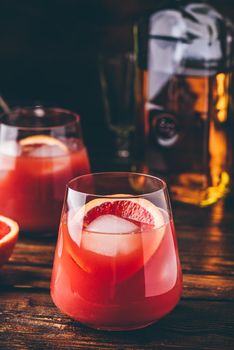 Whiskey sour cocktail with aged bourbon, blood orange juice and cherry syrup