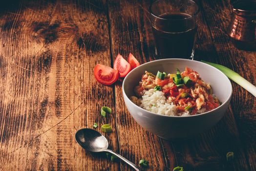 Scrambled eggs with tomatoes, leek and white rice. Turkish coffee and sliced ingredients.