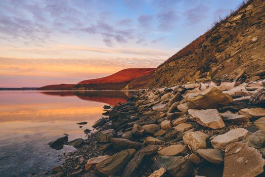 Autumn sunrise on the hilly coast of Zay river