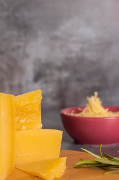 Tray with pieces of Parmesan cheese and fine herbs