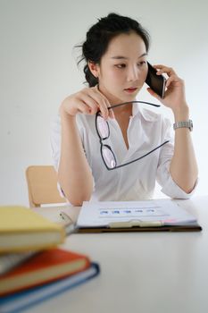 Asian female taking her business team for appointment brainstorm about stock market bearish downtrend