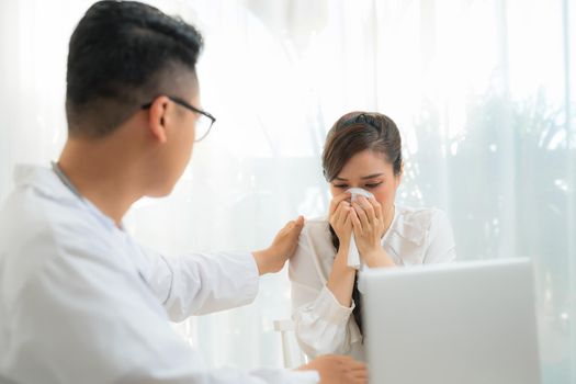 Portrait of female Obstetrician-gynecologist consulting woman in doctors officce