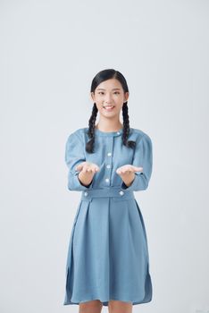 woman showing open hand for product or something portrait on white background