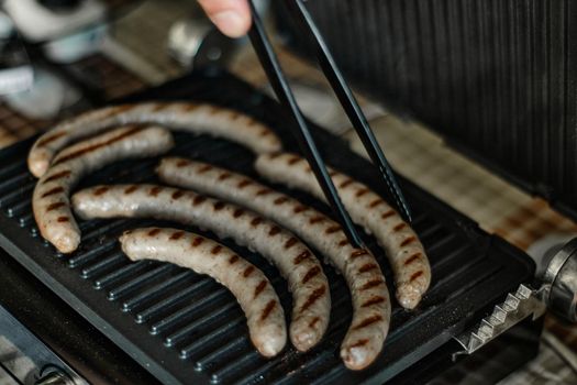 Grilled sausages are cooked, close up shot