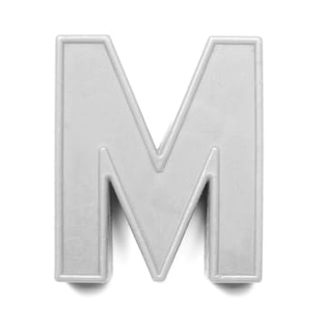 Magnetic uppercase letter M of the British alphabet in black and white