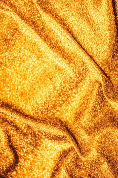 Luxe glowing texture, night club branding and New Years party concept - Golden holiday sparkling glitter abstract background, luxury shiny fabric material for glamour design and festive invitation