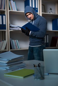 Young man in industrial espionage concept