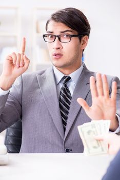 Businessman being offered bribe for breaking law