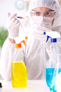 Chemist testing chemical substances in lab