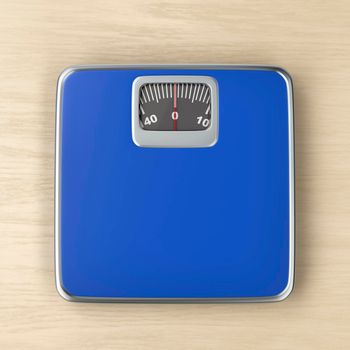 Analog weight scale on the wood floor, top view