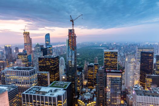 New York City skyline with Manhattan urban skyscrapers at dramatic after the storm sunset over famous 5th avenue, USA.