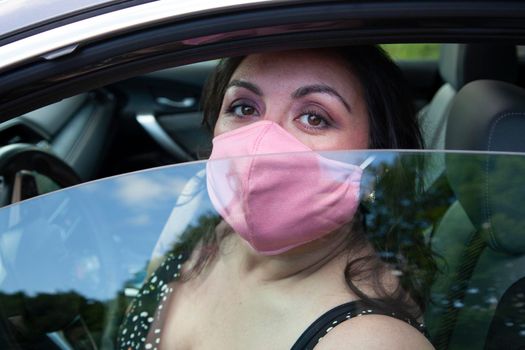 woman traveling in her car during covid 19 