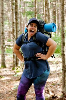 Person with an over the top excited expression in the woods 