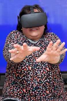 Person experiencing a virtual reality headset is very scared of what they see 