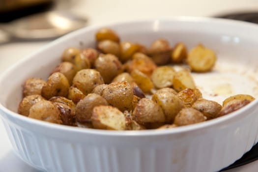 Little roast potatoes in a casserole dish 