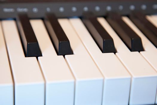  Black and white keys on an electronic piano keyboard