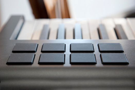 A digital piano keyboard with midi pads for creating sounds 