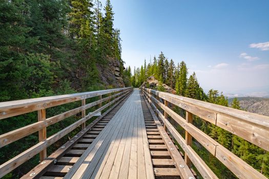 Old railroad bridge transformed to pedestrian pathway over Myra canyon in Okanagan valley