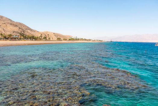 A view of the coral reef above the water. The Red Sea. Beach in the city of Eilat, Israel High angel. High quality photo