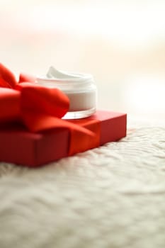 Beauty, cosmetics and skincare styled concept - Luxury face cream jar and red gift box