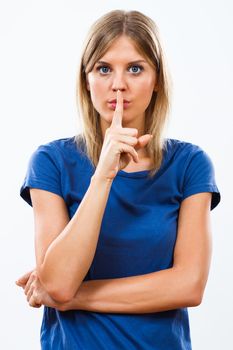 Young woman having a secret isolated on white background