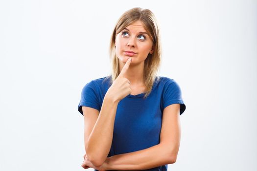 Young woman thinking isolated on white background