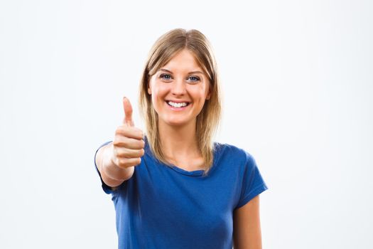 Young woman showing thumb up isolated on white background