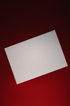 Blank A4 paper, white on red background as office stationery flatlay, luxury branding flat lay and brand identity design for mockup.