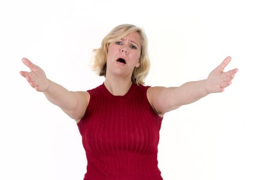 a blond woman in studio background reaches arms and hands out, with a sad or pitying face