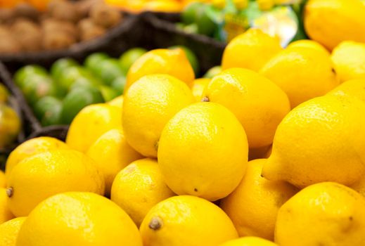  fresh yellow lemons at a farmers market 