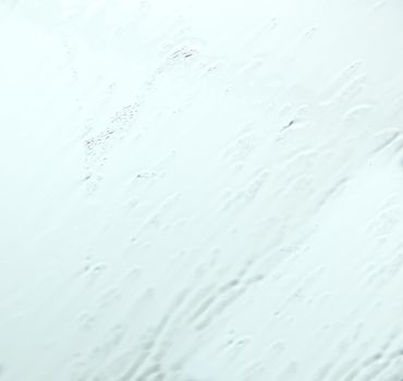 blue coloured glass, texture or background pattern of rain on a window