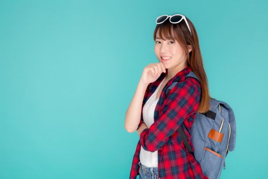 Beautiful portrait young asian woman wear sunglasses on head smile confident thinking and idea summer holiday isolated blue background, model girl fashion in vacation, travel concept.